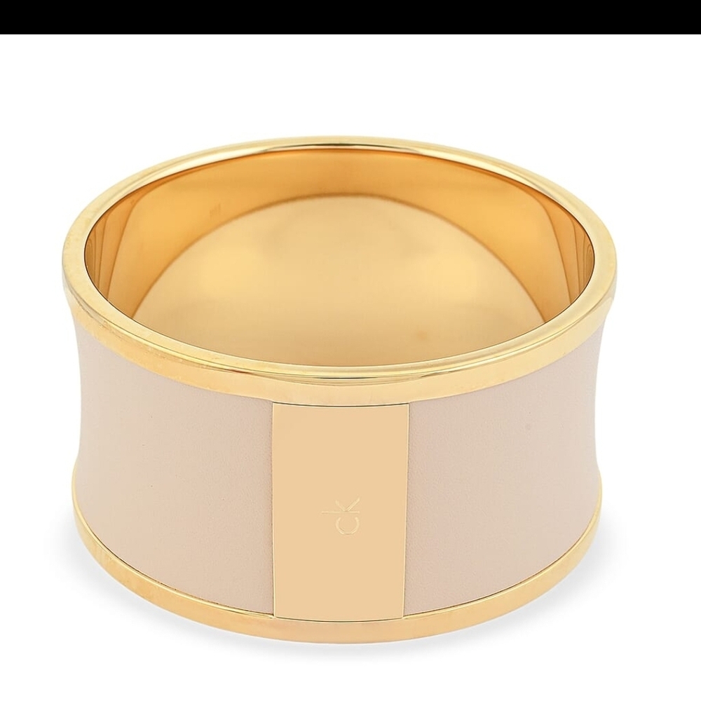 Calvin Klein Spellbound 7in Wide YG Ion plated SST Bangle With Cream Accent
